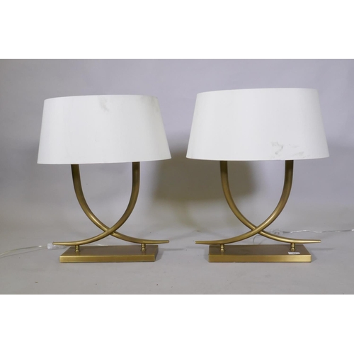 69 - A pair of R.V. Astley 'Iva' table lamps in antiqued brass finish, 59cm high with shade