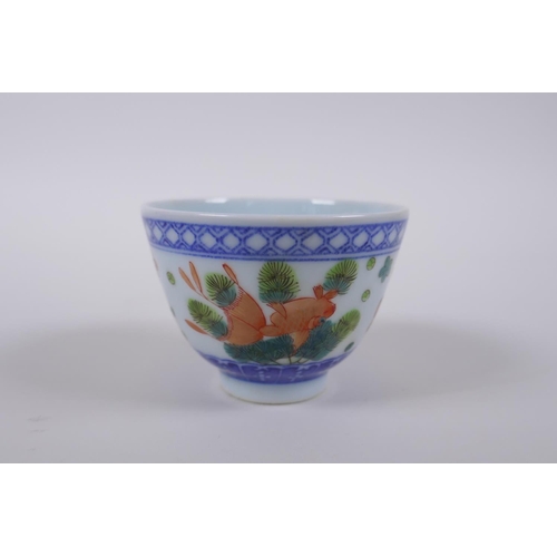 70 - A blue and white porcelain tea bowl with iron red goldfish decoration, Chinese Dao Guang seal mark t... 