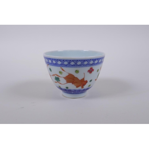 70 - A blue and white porcelain tea bowl with iron red goldfish decoration, Chinese Dao Guang seal mark t... 