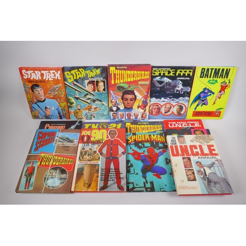 77 - An assorted collection of retro British children's TV annuals including Thunderbirds, Captain Scarle... 