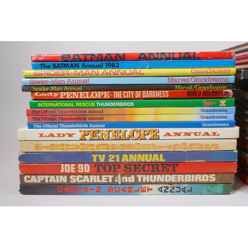 77 - An assorted collection of retro British children's TV annuals including Thunderbirds, Captain Scarle... 