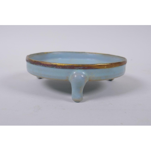 80 - A Chinese Ru-ware style porcelain shallow censer raised on tripod supports with gilt metal rim, 14cm... 