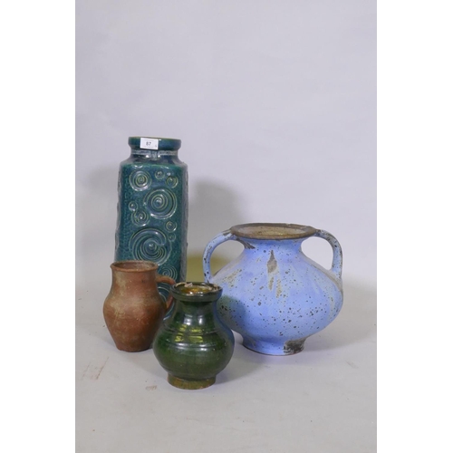 87 - A studio pottery pot with two handles and blue glaze, 23cm high, a green glazed pot, terracotta pot ... 