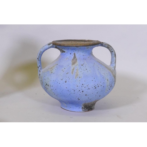 87 - A studio pottery pot with two handles and blue glaze, 23cm high, a green glazed pot, terracotta pot ... 