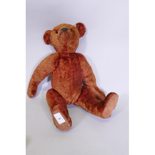 9 - An antique red plush hump back teddy bear, 46cm long