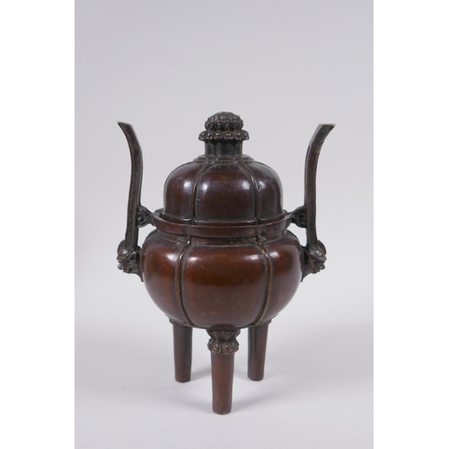 91 - A Chinese bronze censer and cover of gourd form with two handles and tripod supports, 4 character ma... 