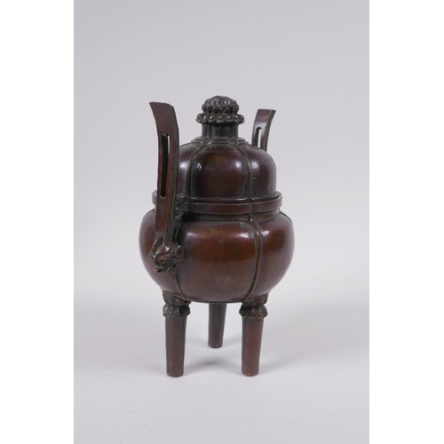 91 - A Chinese bronze censer and cover of gourd form with two handles and tripod supports, 4 character ma... 