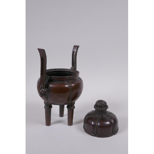 91 - A Chinese bronze censer and cover of gourd form with two handles and tripod supports, 4 character ma... 