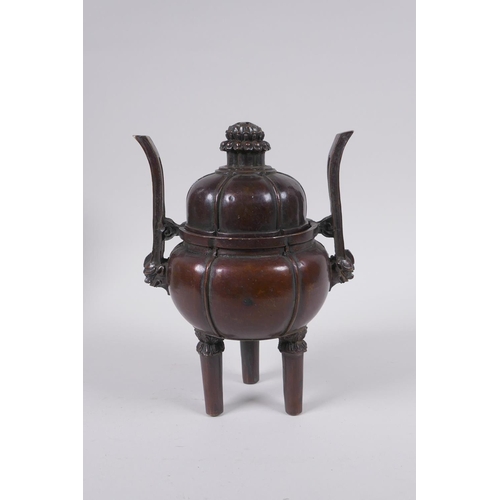 91 - A Chinese bronze censer and cover of gourd form with two handles and tripod supports, 4 character ma... 