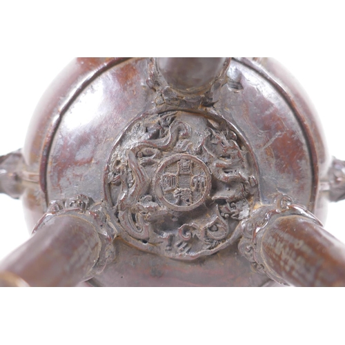 91 - A Chinese bronze censer and cover of gourd form with two handles and tripod supports, 4 character ma... 