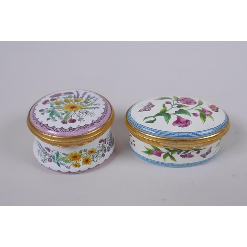 92 - Four Limoges hand painted porcelain trinket/pill boxes with floral decoration, and two Halcyon Days ... 