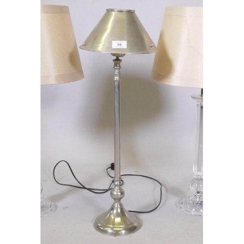 94 - A pair of lucite/acrylic table lamps, 68cm high with shade, and a brushed metal lamp and shade