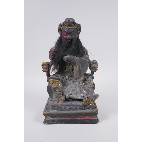 98 - A Chinese carved, lacquered and gilt figure of a seated emperor, 28cm high