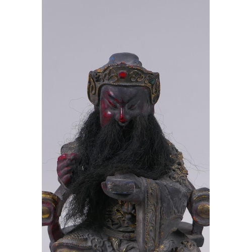 98 - A Chinese carved, lacquered and gilt figure of a seated emperor, 28cm high