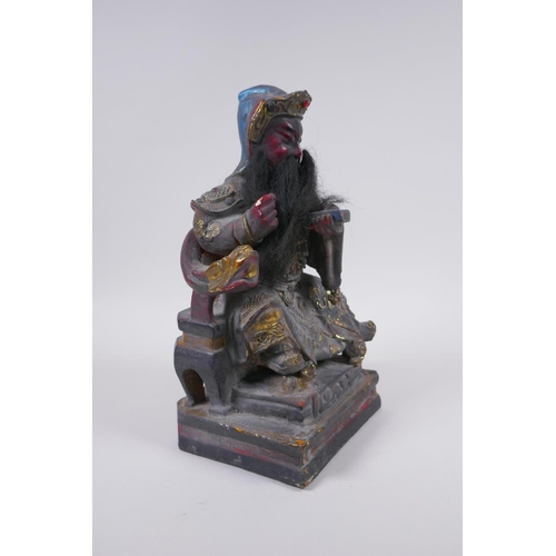 98 - A Chinese carved, lacquered and gilt figure of a seated emperor, 28cm high