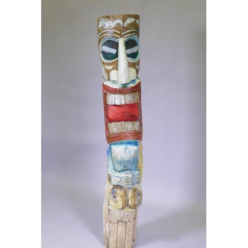 1028 - A carved and painted wood totem pole, 155cm high