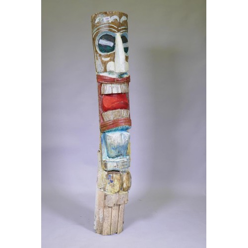 1028 - A carved and painted wood totem pole, 155cm high