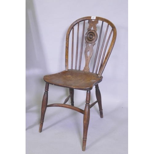 1163 - An early C19th elm wheel back dining chair with crinoline stretcher, AF, and an C18/C19th French oak... 