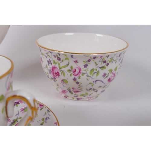 222 - An Arklow pottery six piece coffee set with a transfer printed rose decoration, one cup different, l... 