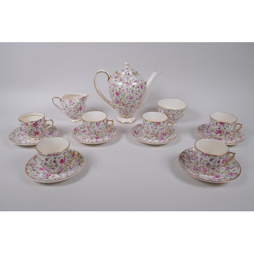 222 - An Arklow pottery six piece coffee set with a transfer printed rose decoration, one cup different, l... 