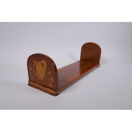 1 - A C19th Irish Kilarney satinwood inlaid yew wood book slide, decorated with harps and clover