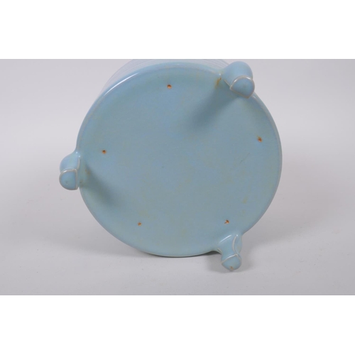 100 - A Chinese Ru ware style porcelain cylinder censer on tripod supports, 17cm diameter