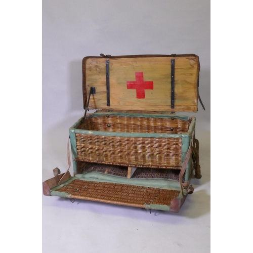 1013 - A WWI RAMC Field Surgical pannier, canvassed basket with leather and metal strapwork, 36 x 36 x 75cm