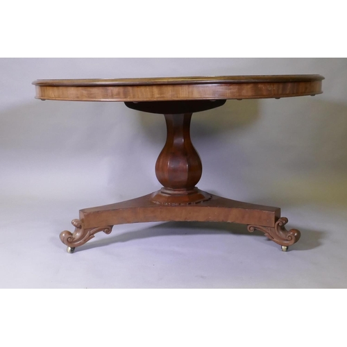 1016 - A C19th mahogany tilt top breakfast table, raised on a shaped column and tri-form platform base with... 