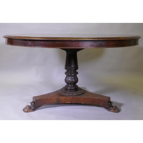 1017 - A Victorian mahogany tilt top breakfast table, with carved column and triform platform base raised o... 