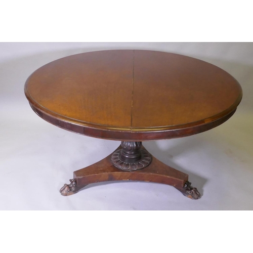 1017 - A Victorian mahogany tilt top breakfast table, with carved column and triform platform base raised o... 