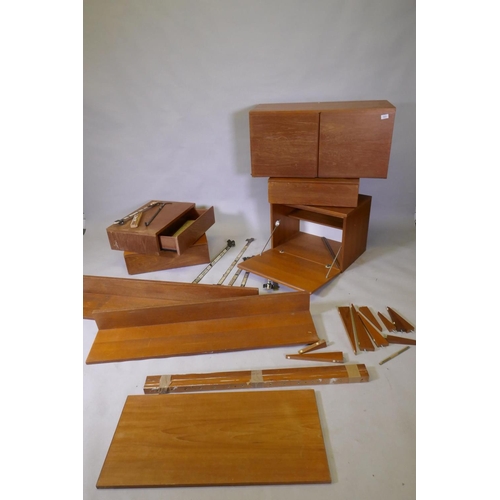 1021 - A mid century teak Tapley 33 wall system, by Beaver & Tapley, designed by Peter Weston, comprisi... 