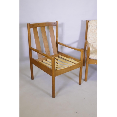 1026 - A pair of Ercol beech and wood open armchairs