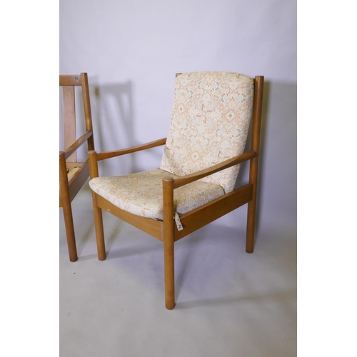 1026 - A pair of Ercol beech and wood open armchairs