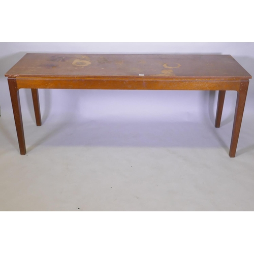 1027 - A mid century oak veneered serving table, raised on square tapering supports with pegged joints, 62 ... 