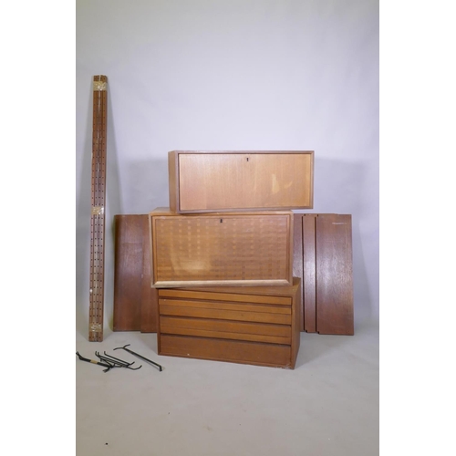 1029 - A mid century Danish teak System Cado/Royal System by Poul Cadovius, comprising three units, five sh... 