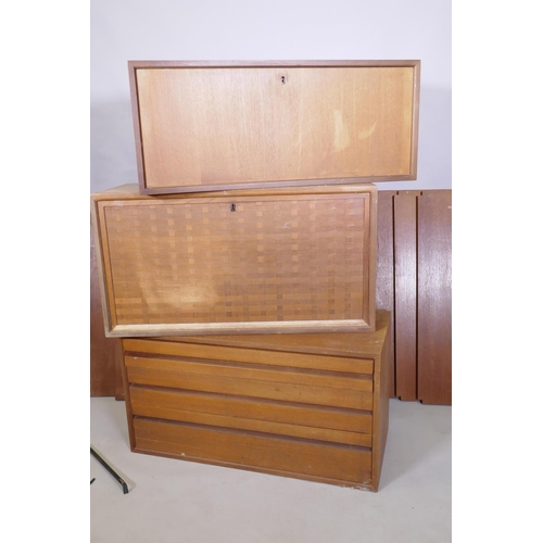 1029 - A mid century Danish teak System Cado/Royal System by Poul Cadovius, comprising three units, five sh... 