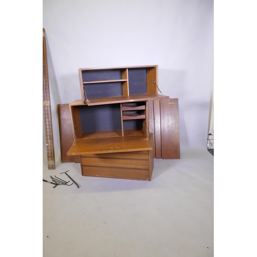 1029 - A mid century Danish teak System Cado/Royal System by Poul Cadovius, comprising three units, five sh... 