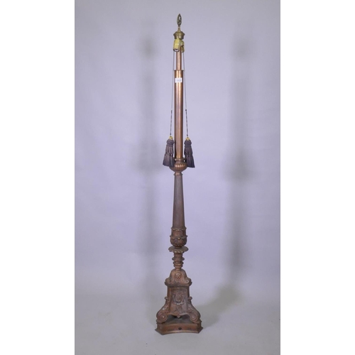 1035 - A copper and bronzed metal floor lamp with fluted column and Renaissance Revival style decoration, 1... 