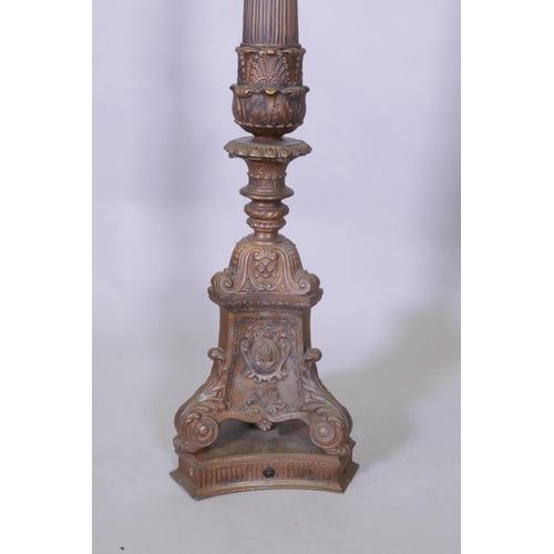 1035 - A copper and bronzed metal floor lamp with fluted column and Renaissance Revival style decoration, 1... 