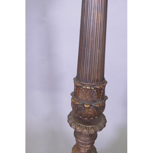 1035 - A copper and bronzed metal floor lamp with fluted column and Renaissance Revival style decoration, 1... 