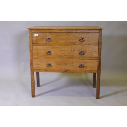 1039 - An Edwardian oak chest of three long drawers, raised on square supports, 84 x 43 x 83cm