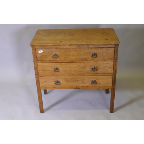 1039 - An Edwardian oak chest of three long drawers, raised on square supports, 84 x 43 x 83cm