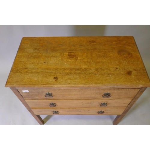 1039 - An Edwardian oak chest of three long drawers, raised on square supports, 84 x 43 x 83cm