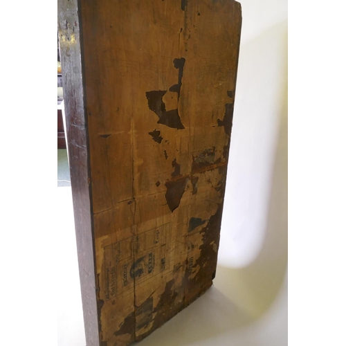 1040 - A Georgian oak hanging corner cupboard, fielded panel door and shaped shelves, 90 x 124cm