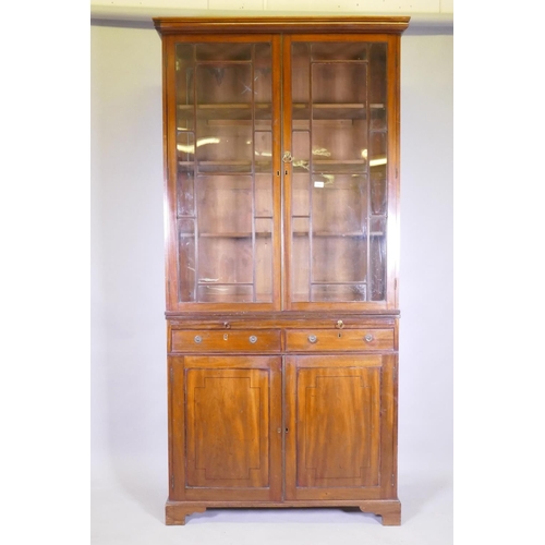 1042 - A George III mahogany bookcase, the upper section with astragal glazed doors and adjustable shelves,... 