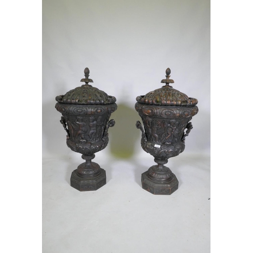 1048 - A pair of carved wood urns and covers with classical style decoration of putti riding a goat, 87cm h... 