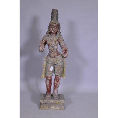 105 - An Indian carved and painted wood Buddhistic figure, 92cm high