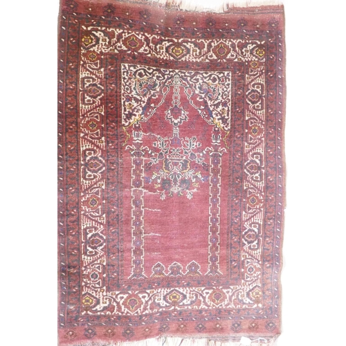 1056 - An antique Persian prayer rug, with lantern design, on a red field, 95 x 137cm