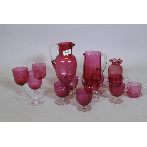 106 - A quantity of Victorian cranberry glass, jugs, drinking glasses and custard cups