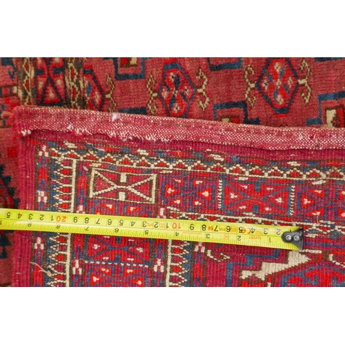 1060 - A rust ground Jibal Bokhara rug, 110 x 70cm